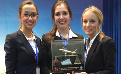 UQ law students, from left, Ella Rooney, Georgina Morgan and Amina Karcic with their trophy UQ law students, from left, Ella Rooney, Georgina Morgan and Amina Karcic with their trophy