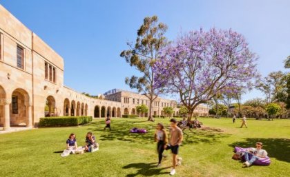 Students in the Great Court at The University of Queensland Students walking on the grass in the Great Court