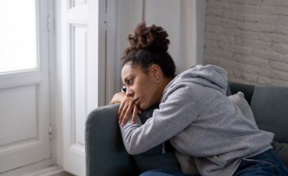 The study highlighted that women who have depression should be assessed for heart disease risk regardless of their menopausal stage. Image: Adobe A lady sulking on a couch