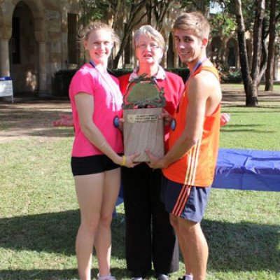 Great Court Race winners Caitlin Sargent and Jordan Pearce are congratulated by Patricia Jones of The Alumni Friends of The University of Queensland.