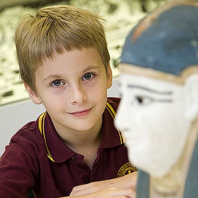 James Hudson in the UQ Antiquities Museum with the 2400-year-old Egyptian mummy mask he voted for in the Treasures competition